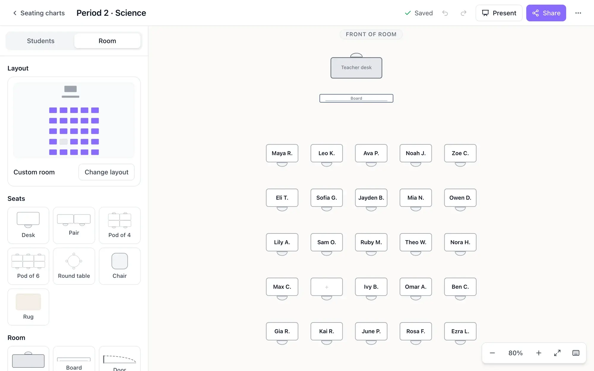 Room tab of the seating chart editor with the current layout, a Change layout button, seat furniture (desk, pair, pod of 4, pod of 6, round table, chair, rug) and room items (teacher desk, board, door) next to the classroom