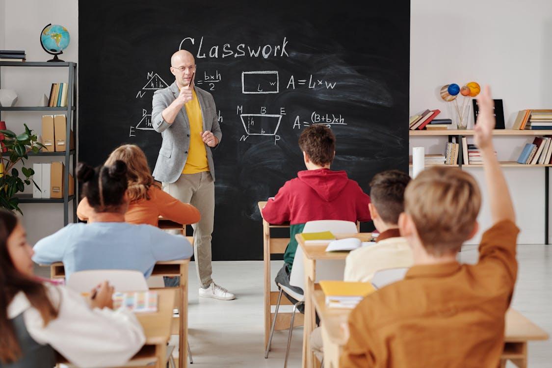 Teachers using AI tools in a modern classroom