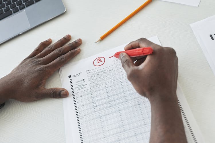 Teacher using AI to grade student essays efficiently