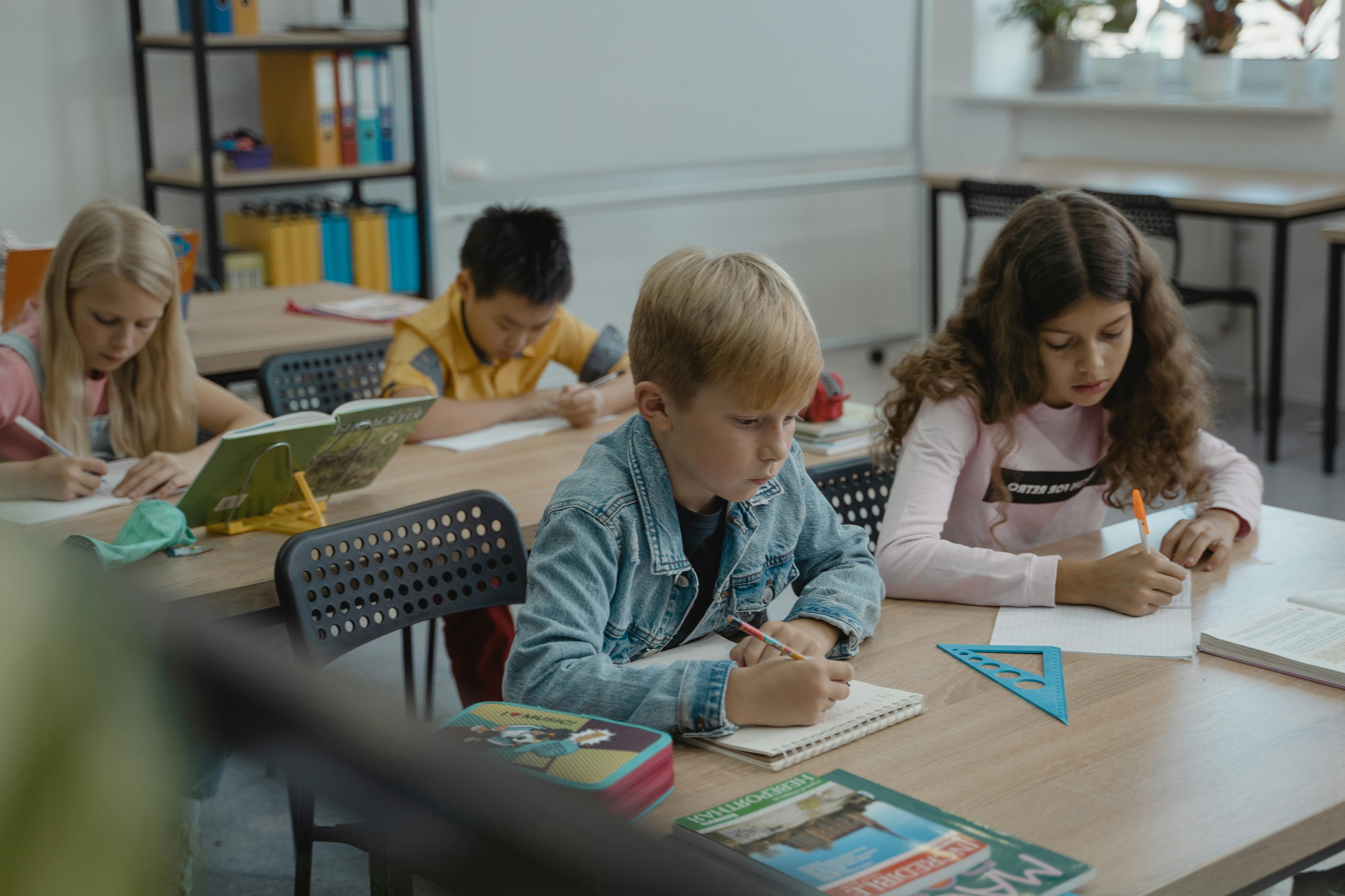 Teacher reviewing and proofreading documents at a desk
