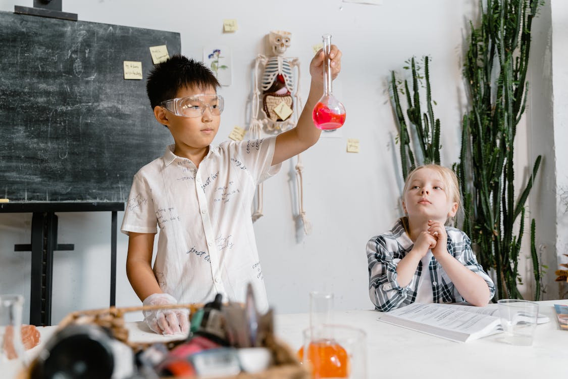 Teacher reviewing a printed worksheet with a student